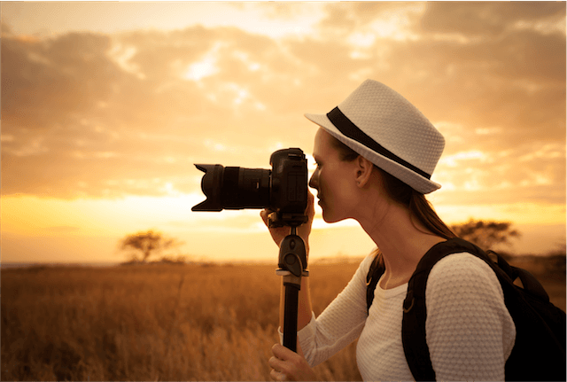 lady camera hat wild sunset tripod photographer locations
