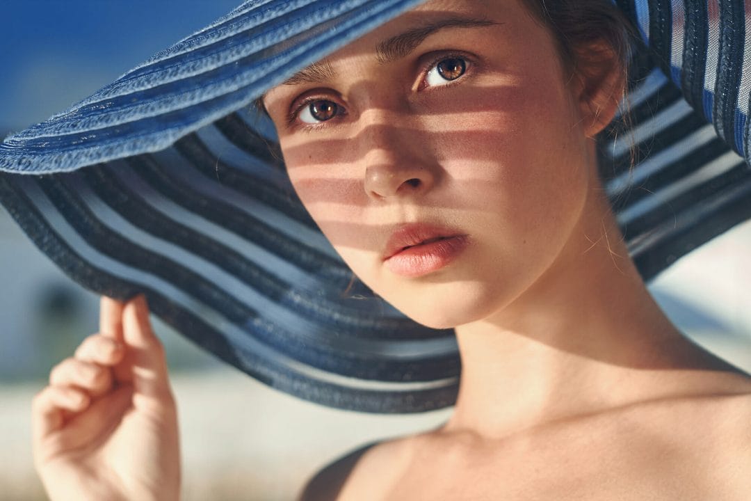 female hat portrait photography blue shadow face