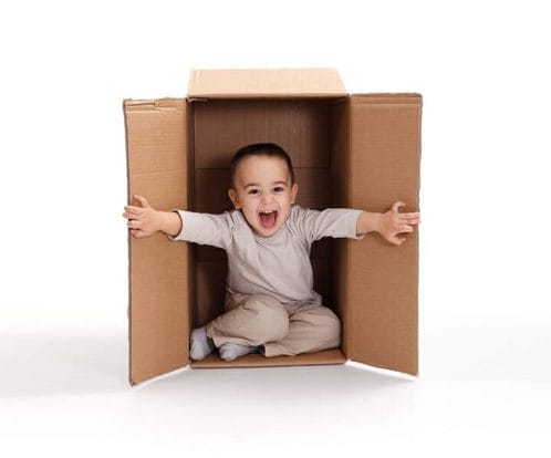 child bursting out of a box