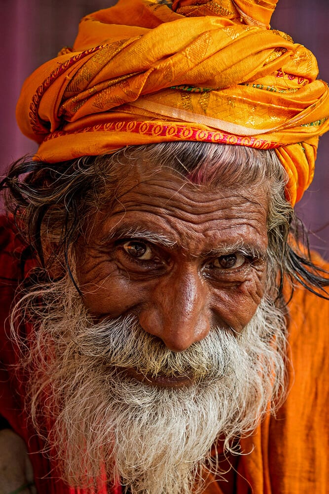 elder man male orange clothing wrinkles detail photography travel