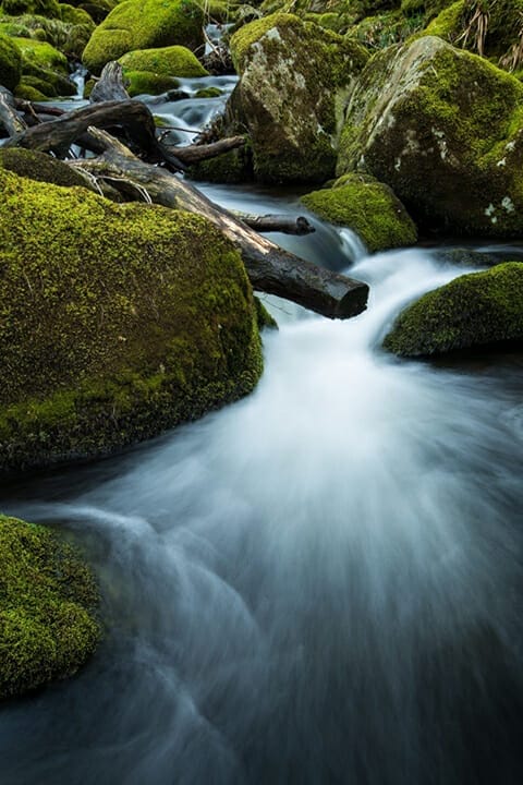 waterfall water green rocks moss calm slow shutter speed
