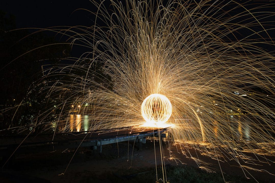 wire wool fire spinning long exposure light trick photography
