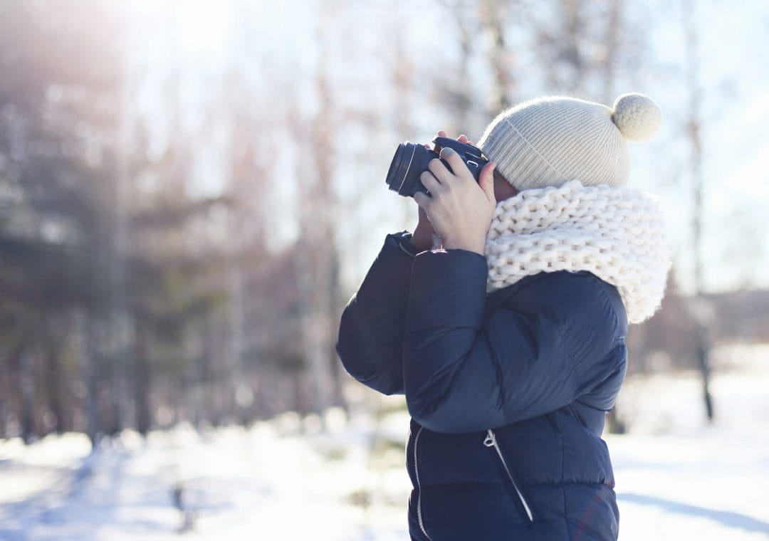 child camera winter photography hat bobble jacket snow cold