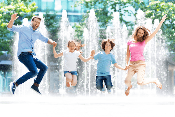 family portrait jumping kids mum and dad parents water fountain happy lifestyle iphotography