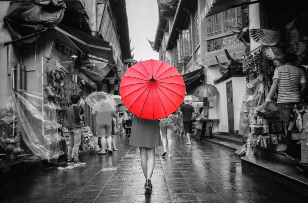 lady red umbrella market walking colour splash