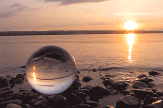 glass ball stones shore sunset reflection cinemagraph