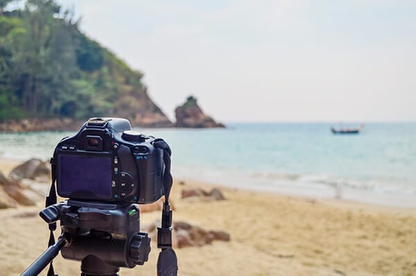 camera on tripod beach photography levitation