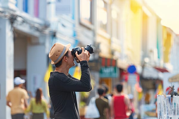 man camera street photography tips hat