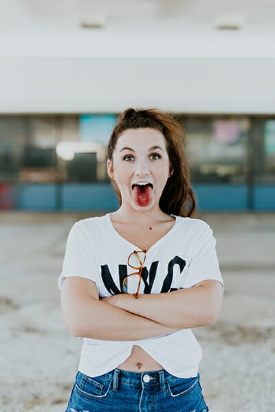 girl sticking tongue out high key light