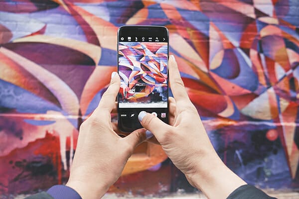 photograph urban graffiti purple smartphone