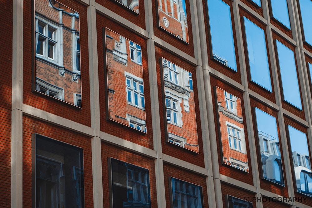 reflections on the windows of a building in London