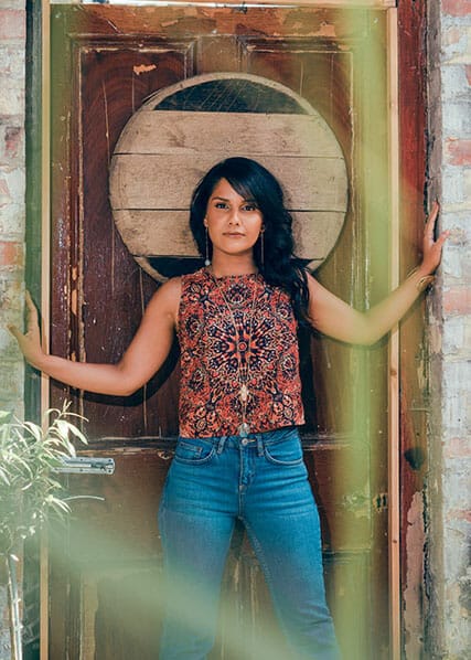 a woman standing in a door cropping photography example
