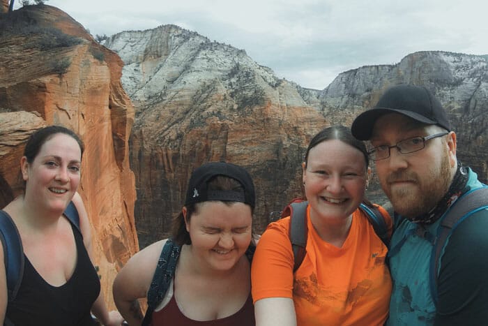 hiking angels landing group of friends expensive camera equipment