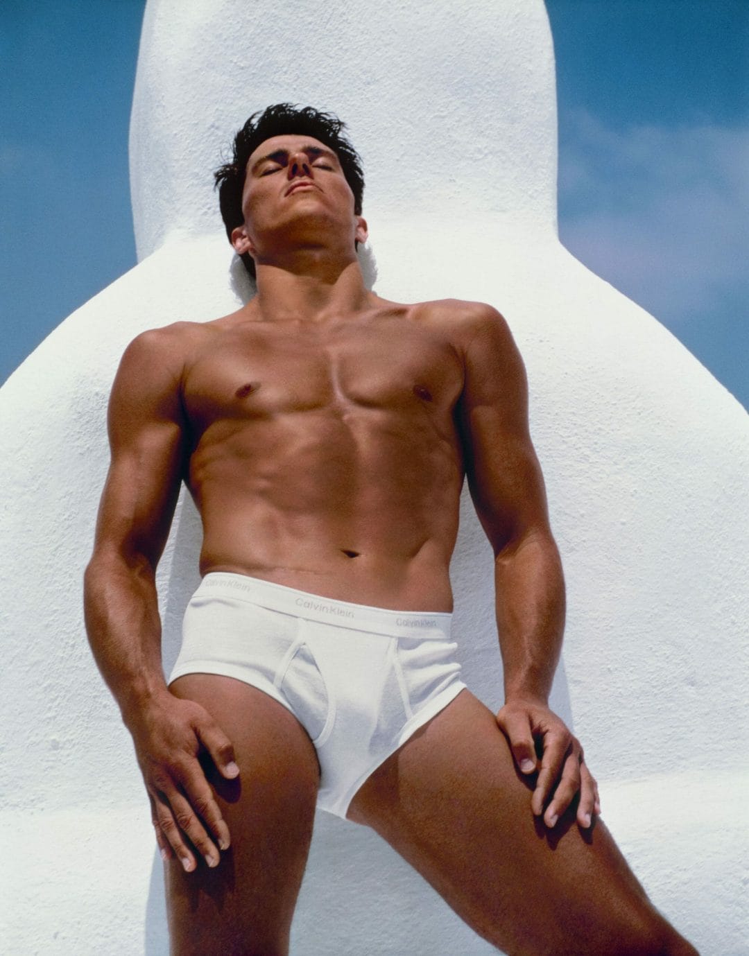 Bronzed muscular man in underwear sunbathing LGBTQ+ photography
