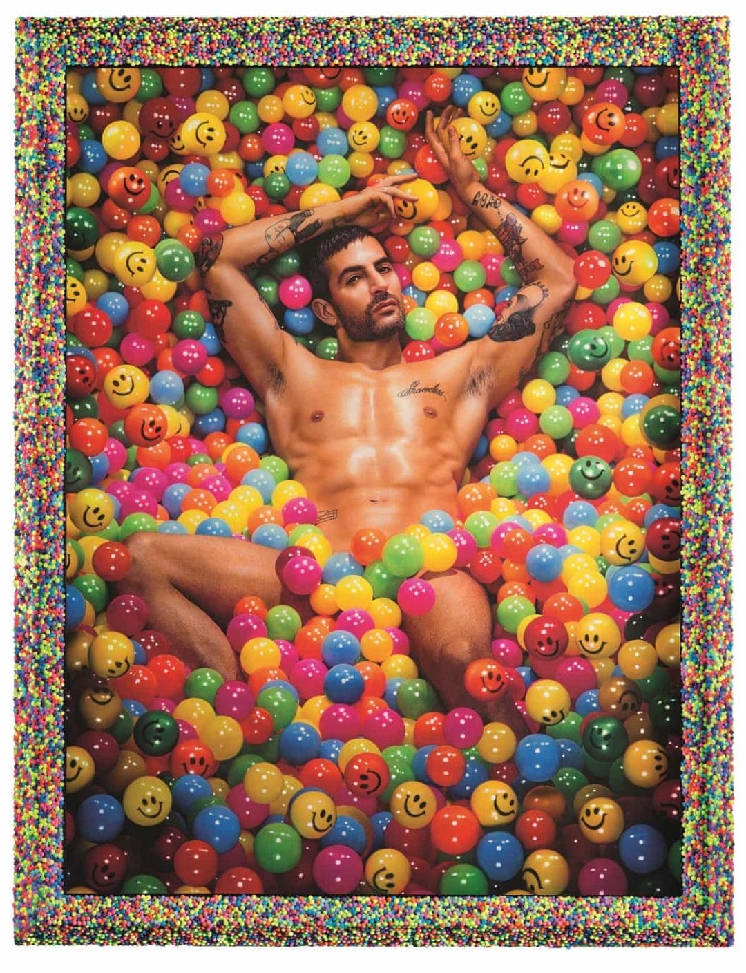 Naked man in a ball pool