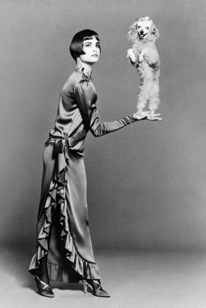 a woman holding a poodle standing on his hind legs LGBTQ+ photography
