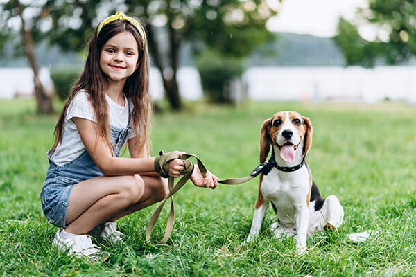 pet photography girl crouched with dog sat on lead 1