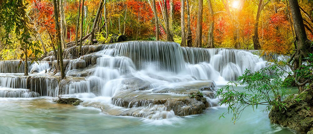panorama of long exposure waterfall in autumn fall photography