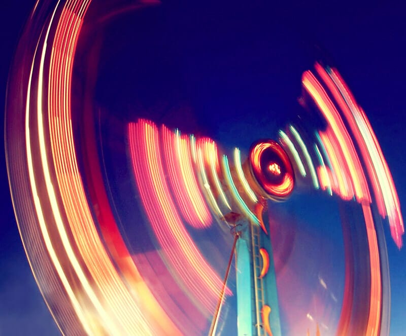 shutter speed ferris wheel in motion at night