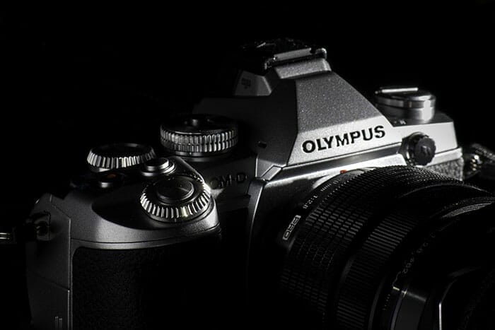 Olympus camera on black background
