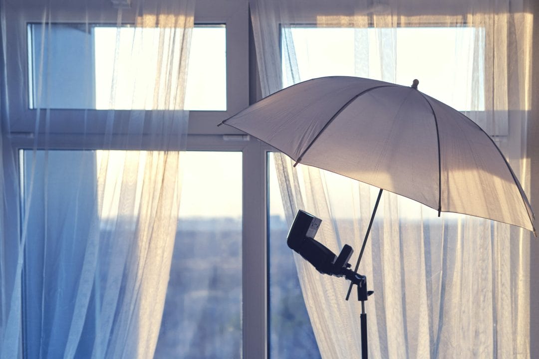 Umbrella,And,Flash,For,The,Camera,On,The,Background,Of Real Estate Photography - Flash with Umbrella
