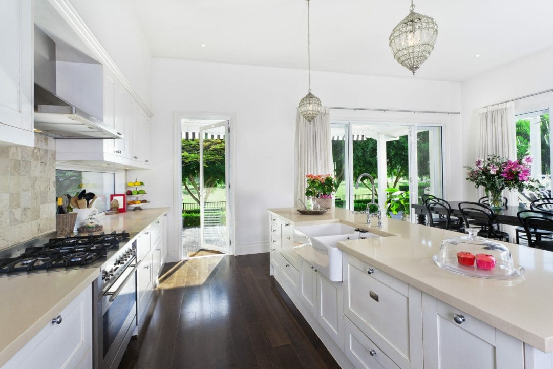 Stylish,Open,Plan,Kitchen,With,Stainless,Steel,Appliances,And,Dining Room Scene with Natural Light