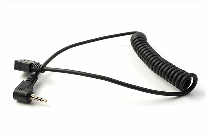 The,Connection,Cable,Is,Isolated,On,A,White,Background.,Concept Flash Photography Tutorial Flash Sync Cable 3