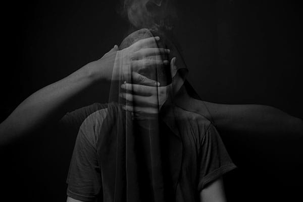 Dark,Surrealism,Photography,Concept,Portrait,Of,Man,With,Hand,Cover