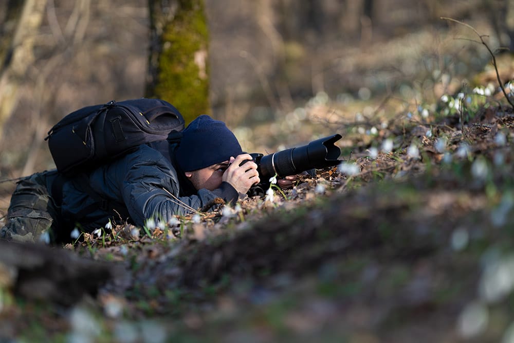 Nature Photography TIps man behind a camera screen
