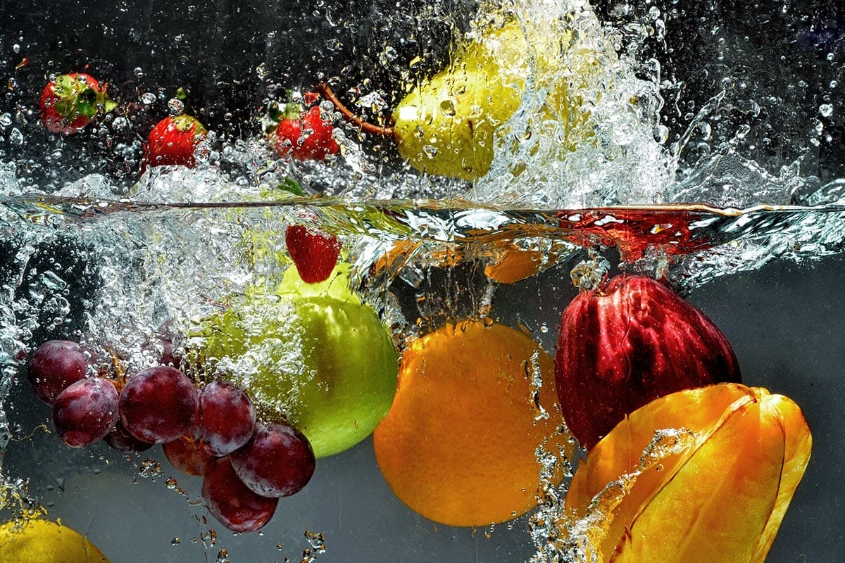 Splashing,Fruit,On,Water.,Fresh,Fruit,And,Vegetables,Being,Shot