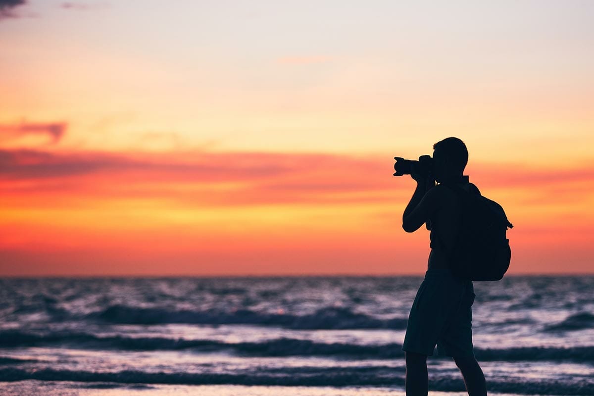 Silhouette,Of,The,Young,Photographer.,Photo,Shooting,During,Amazing,Sunset