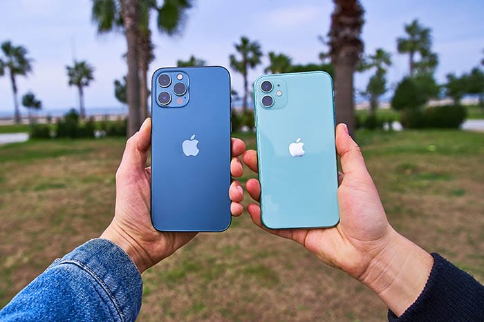 Newest Apple iPhone 12 pacific blue color and Apple iPhone 11 mint green color in hands