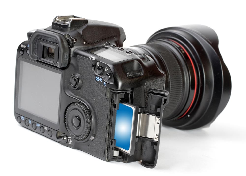 Professional DSLR camera with inserted memory card. Close up with shallow DOF.