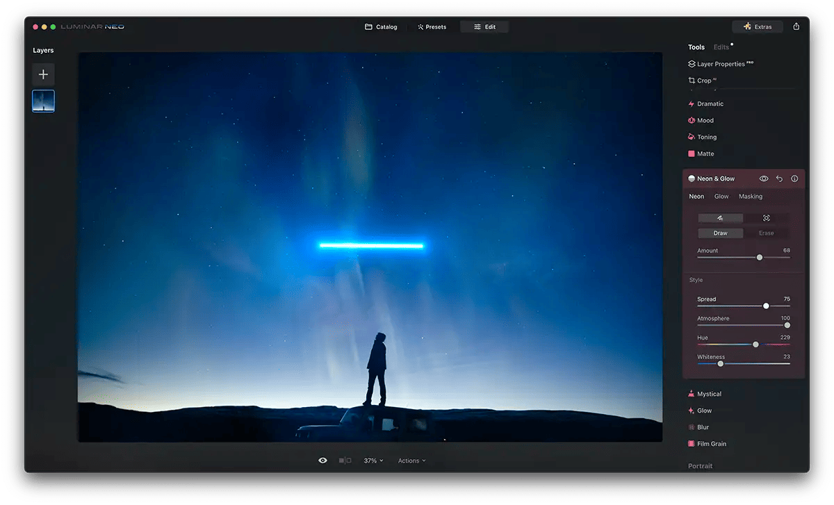 Screenshot of Luminar Neo Neon Glow Effect with a blue glowing bar above a person stood on a car roof at night time. Stars are in the sky.