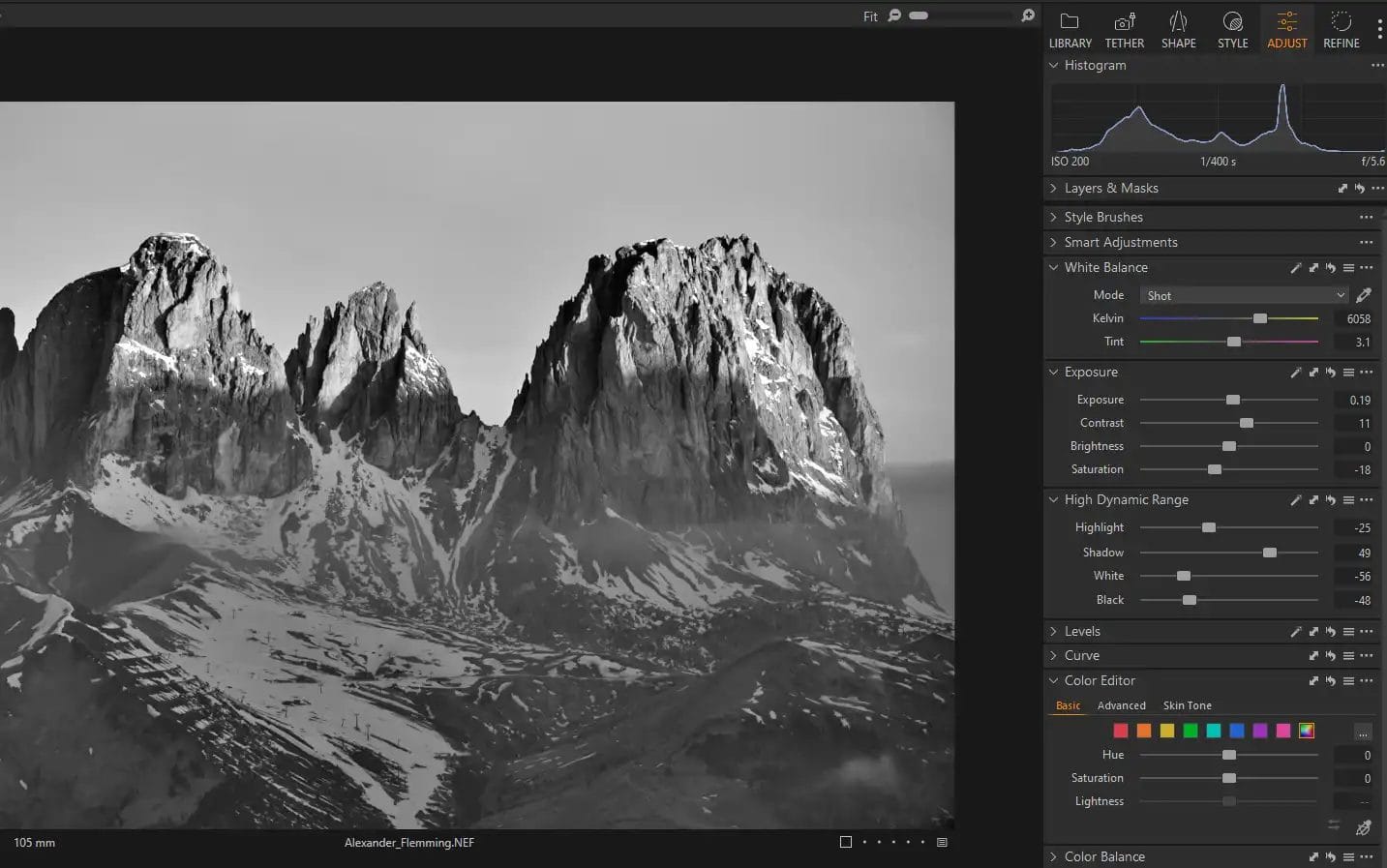 Capture One Photo Editor adjustment tools next to a black and white photo of mountains