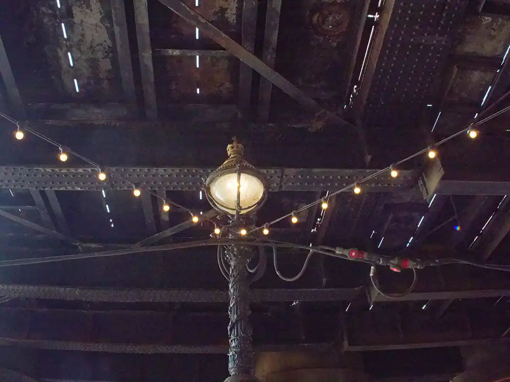 photo of an old London victorian lamp with string lights