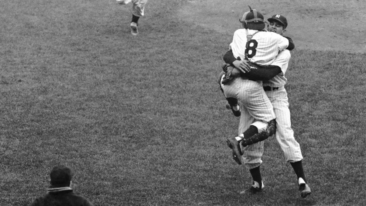 two baseball players, one wearing number 8, celebrating in black and white