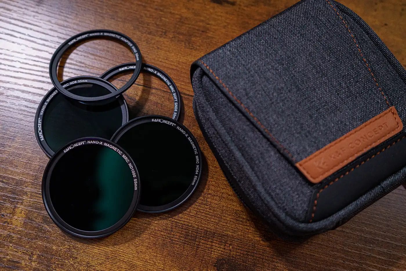 KentFaith 5-in-1 magnetic lens filter kit and pouch on a wooden table